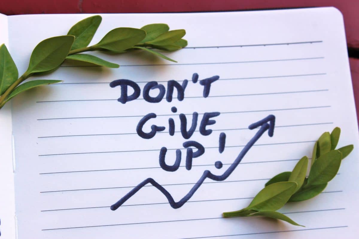 Don't give up written on paper