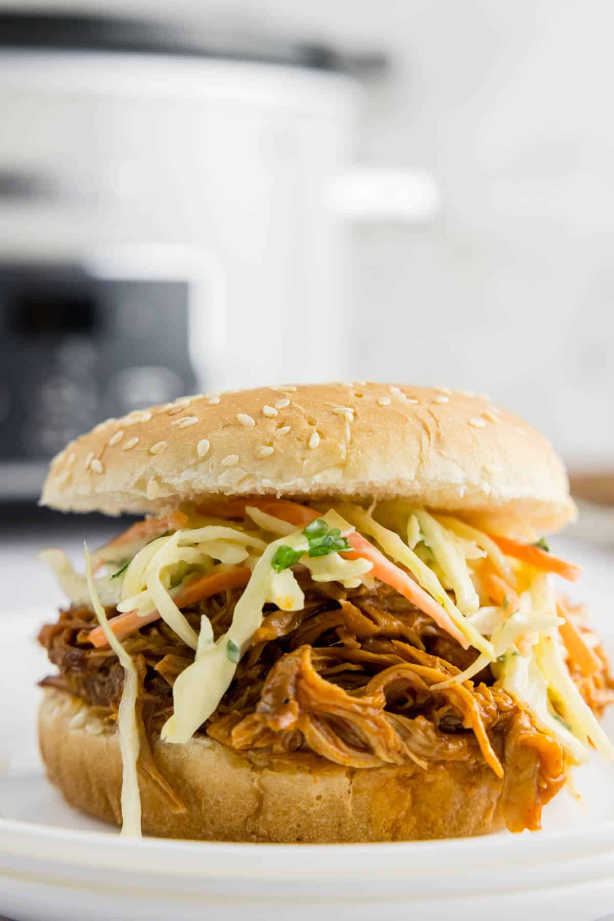 Slow cooker bbq pulled pork sandwich on a plate