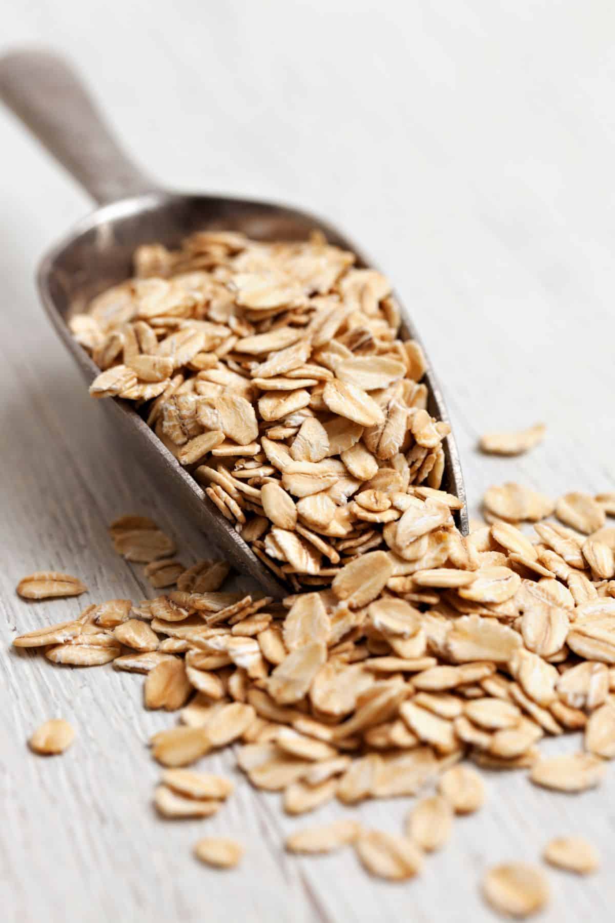 Oatmeal for Weight Gain (Everyone You Need to Know) 2 Rolled oats on a marble countertop