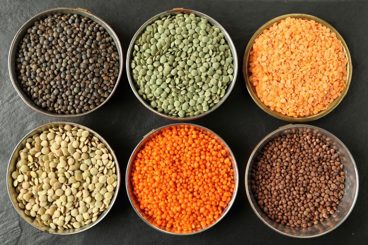 Different types of lentils in bowls.