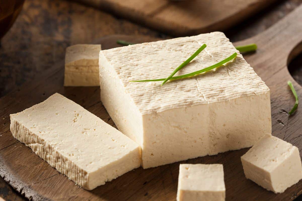 Tofu on a wooden board.