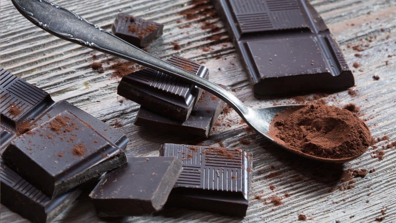 10 Common Foods That Are Secretly High in Calories 6 Dark chocolate on a table