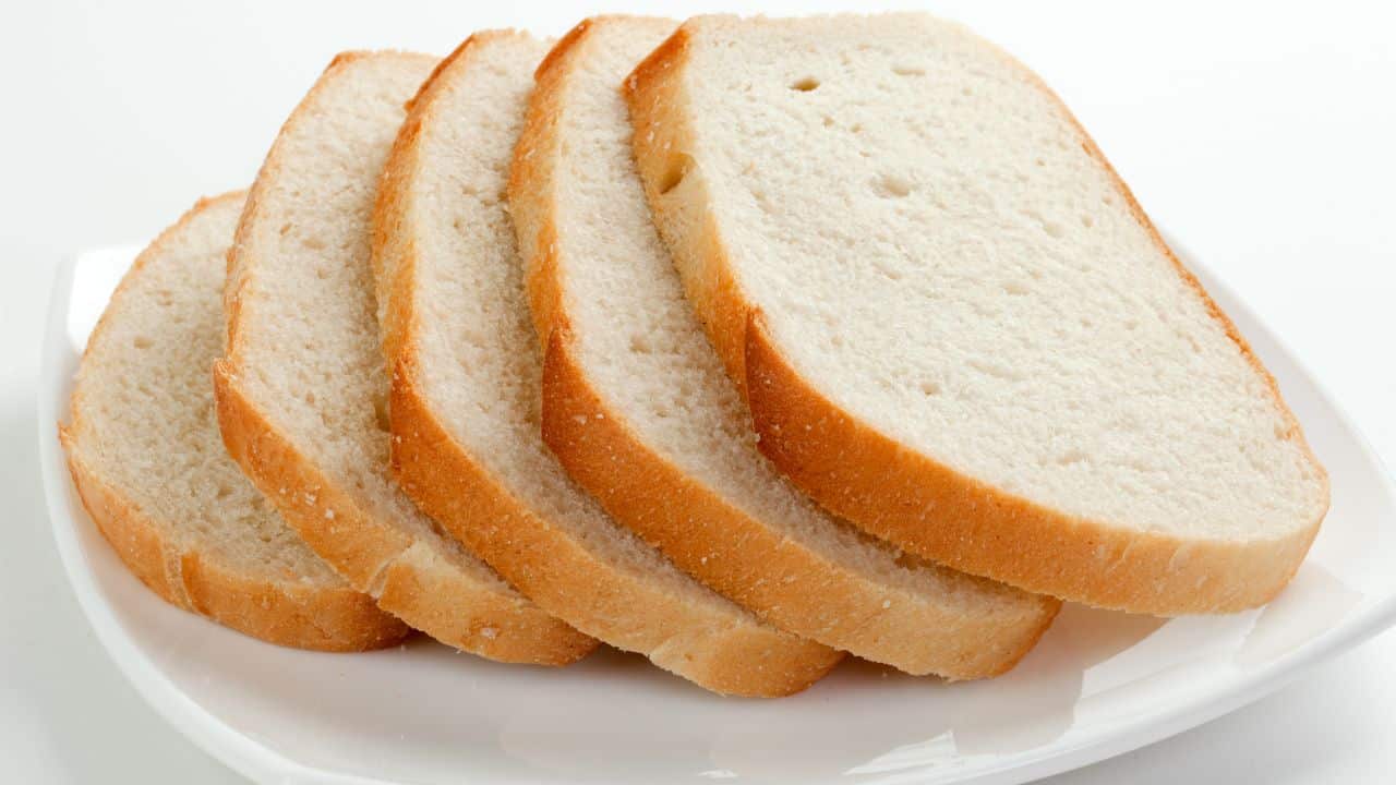 10 High-Calorie Foods To Avoid & 10 That Are Actually Healthy 5 white bread on a plate